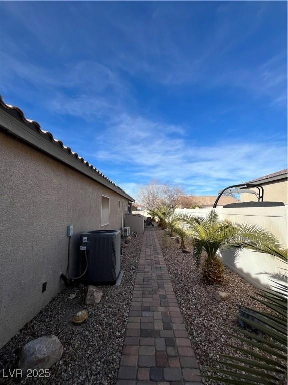 view of yard with central AC unit