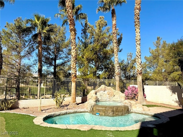 view of pool featuring an in ground hot tub