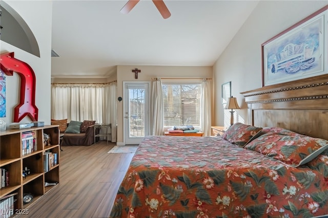 bedroom with vaulted ceiling, ceiling fan, access to exterior, and light hardwood / wood-style floors