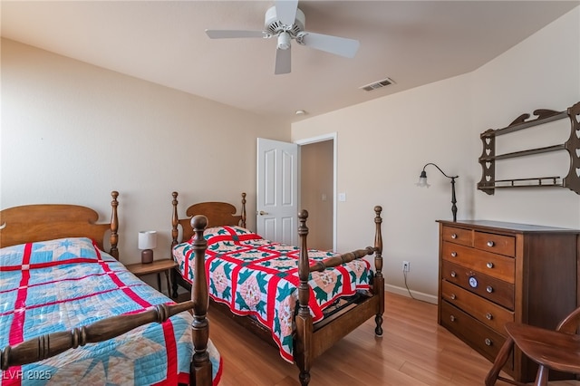 bedroom featuring ceiling fan and light hardwood / wood-style flooring