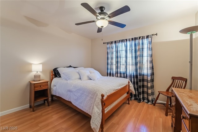 bedroom with light hardwood / wood-style flooring and ceiling fan