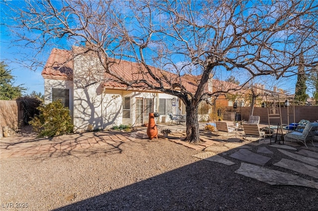 rear view of house with a patio