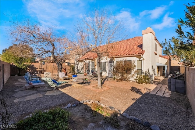 back of house featuring a patio