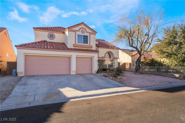 mediterranean / spanish-style home with a garage