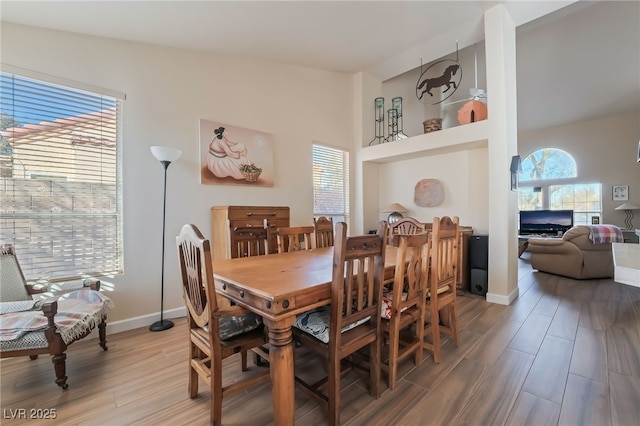 dining area with vaulted ceiling