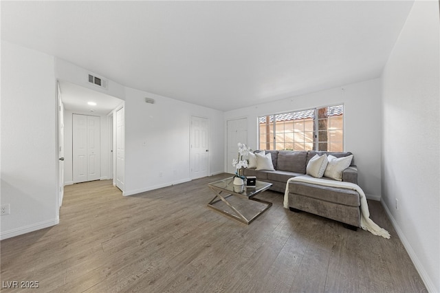 living room with light hardwood / wood-style flooring