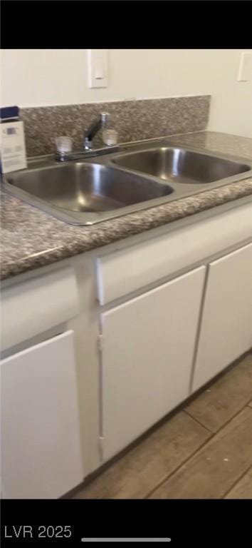 details featuring sink and white cabinets