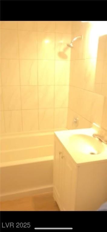 bathroom featuring vanity and shower / bathing tub combination