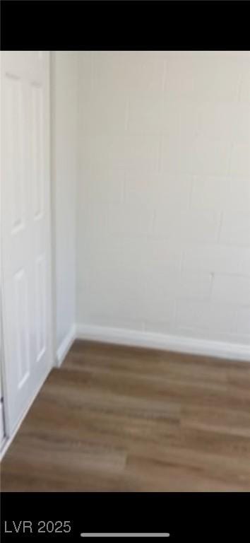 empty room with hardwood / wood-style flooring