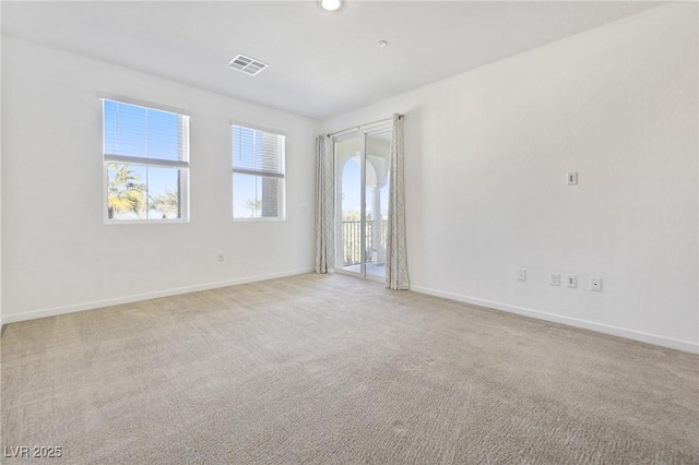 empty room featuring light carpet