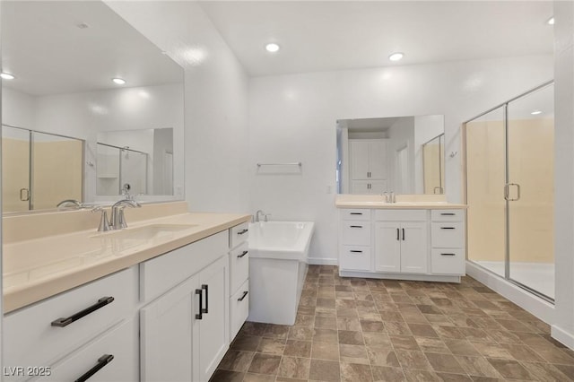 bathroom featuring plus walk in shower and vanity