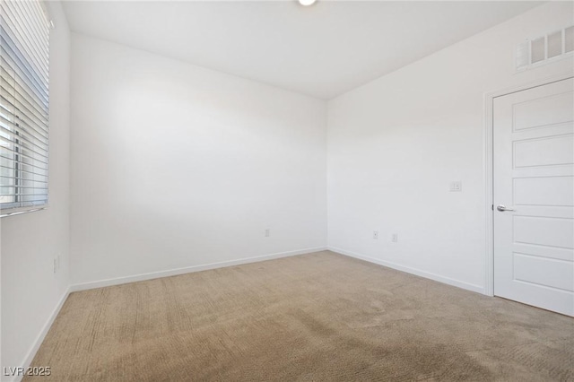 unfurnished room featuring carpet flooring