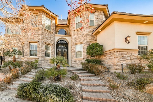 entrance to property featuring french doors