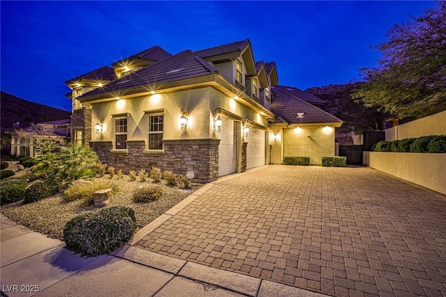 mediterranean / spanish house featuring a garage