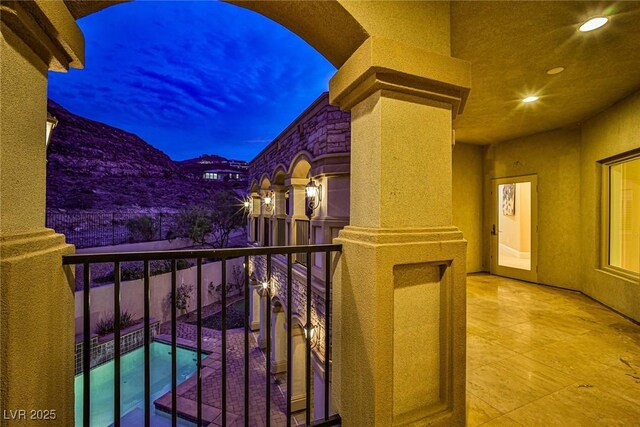 balcony at dusk with a mountain view