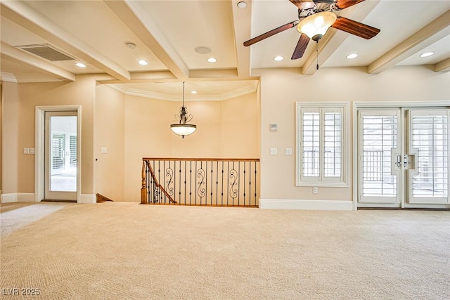 spare room featuring light colored carpet, french doors, and beamed ceiling