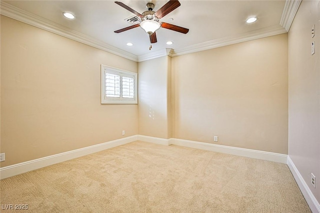 carpeted empty room with ornamental molding and ceiling fan