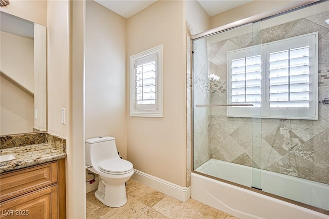 full bathroom with vanity, bath / shower combo with glass door, tile patterned floors, and toilet