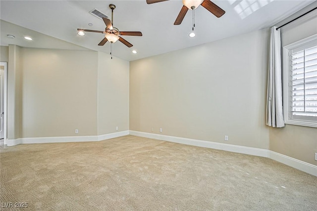 spare room with light carpet and ceiling fan