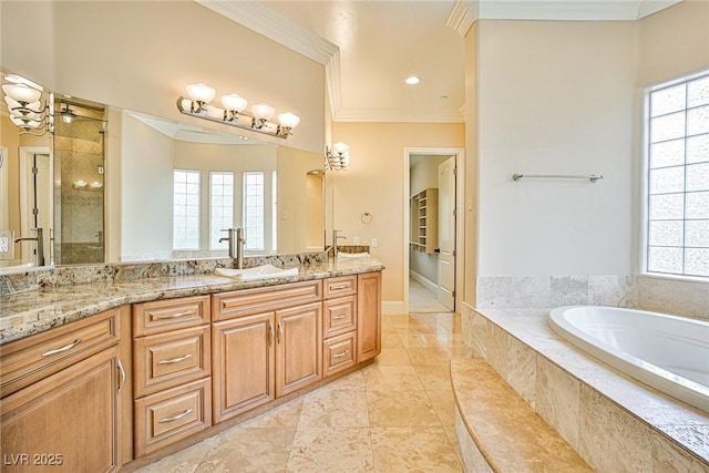 bathroom featuring ornamental molding, a healthy amount of sunlight, vanity, and plus walk in shower