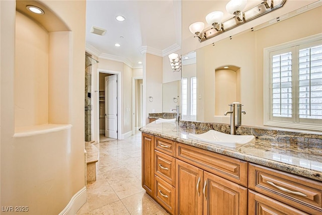 bathroom featuring ornamental molding and vanity