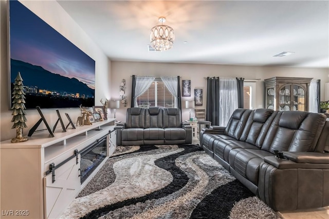 living room featuring an inviting chandelier