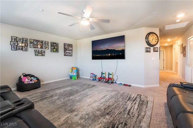 living room featuring ceiling fan and light colored carpet