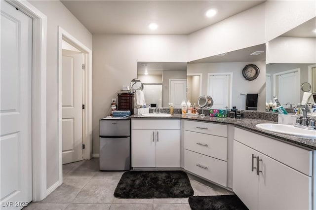 bathroom with vanity and tile patterned floors