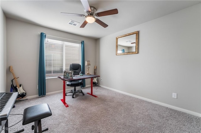 office area with light colored carpet and ceiling fan