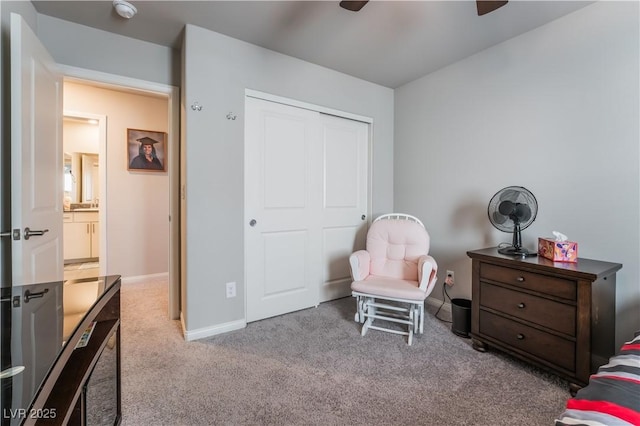 bedroom featuring light carpet, a closet, and ceiling fan