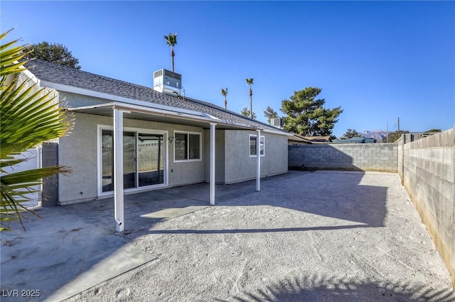 back of property featuring a patio and central air condition unit