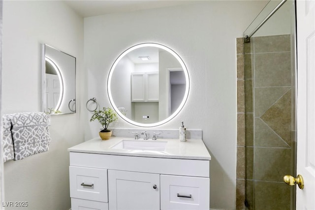 bathroom featuring vanity and tiled shower