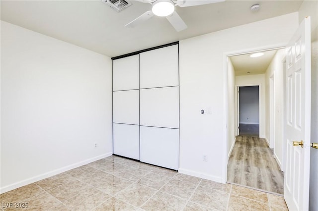 unfurnished bedroom with a closet and ceiling fan