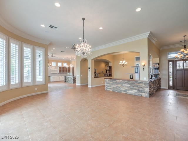 3 Pine Hollow Dr, Henderson, NV 89052 - living area with a chandelier, ornamental molding, arched walkways, recessed lighting, and light tile patterned flooring