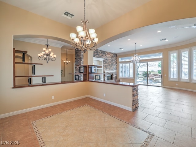 3 Pine Hollow Dr, Henderson, NV 89052 - kitchen with a chandelier, open floor plan, tile patterned flooring, crown molding, and a stone fireplace