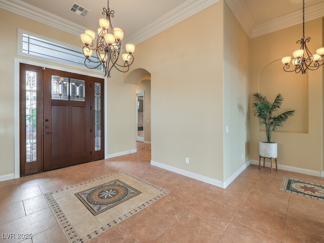 3 Pine Hollow Dr, Henderson, NV 89052 - foyer with a chandelier, arched walkways, and ornamental molding