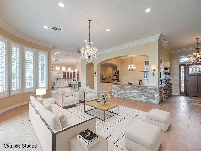 3 Pine Hollow Dr, Henderson, NV 89052 - living area featuring a chandelier, arched walkways, recessed lighting, ornamental molding, and light tile patterned floors