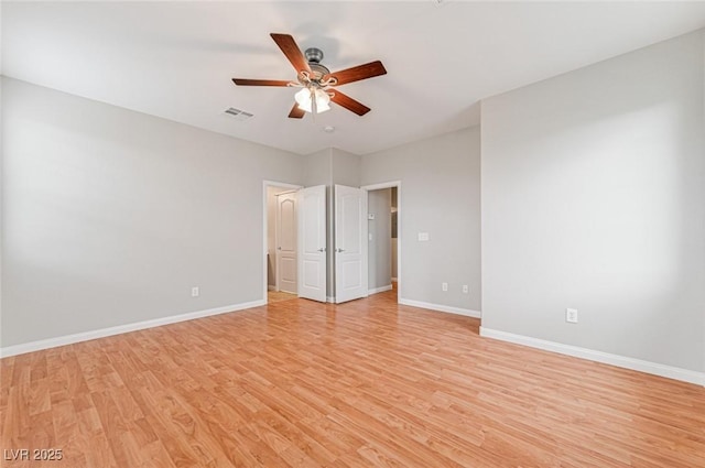 unfurnished bedroom with ceiling fan and light hardwood / wood-style flooring