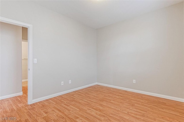 unfurnished room with light wood-type flooring