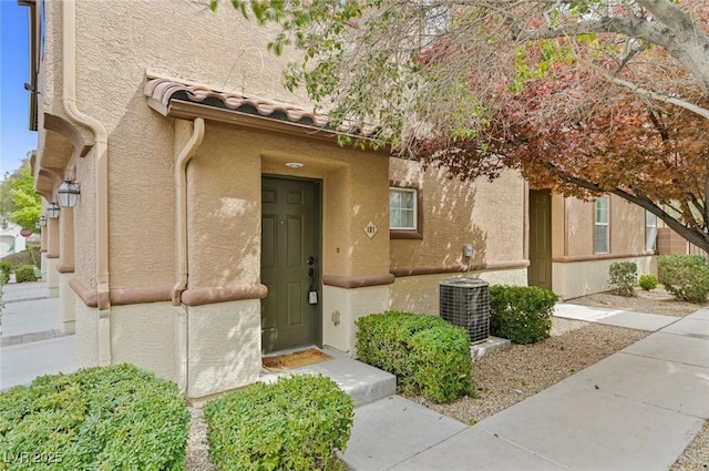 doorway to property with central AC