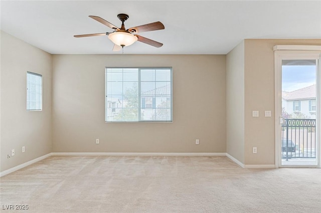 carpeted empty room with ceiling fan