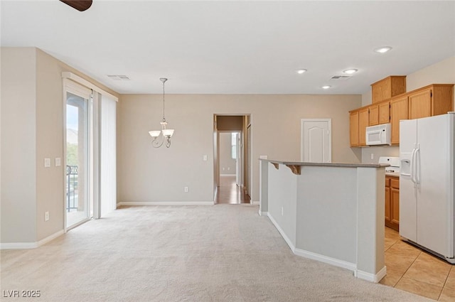 kitchen with white appliances, a breakfast bar, an inviting chandelier, hanging light fixtures, and light carpet