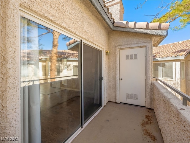 3038 Casey Dr Unit 204, Las Vegas, NV 89120 - entrance to property with a balcony and stucco siding