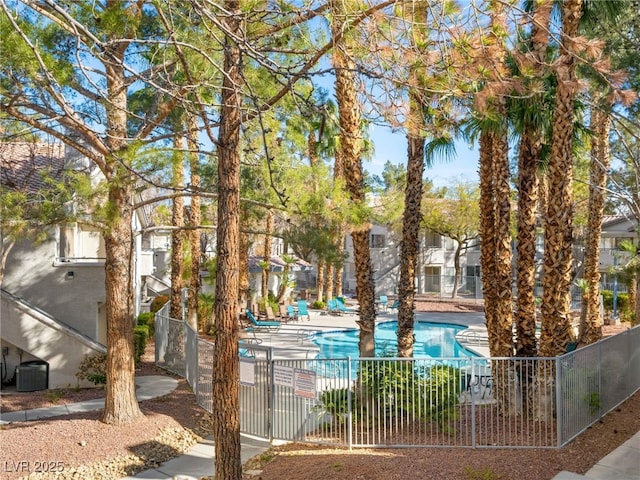 pool featuring fence and central air condition unit