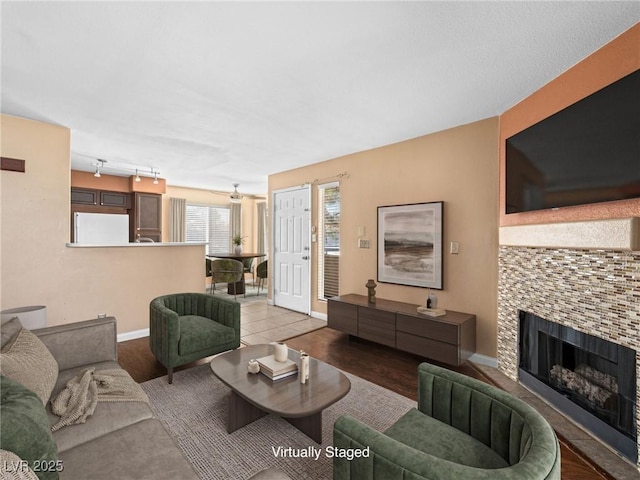 3038 Casey Dr Unit 204, Las Vegas, NV 89120 - living area featuring a tiled fireplace and baseboards