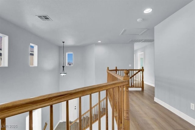 corridor featuring hardwood / wood-style floors