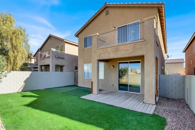 rear view of house with a lawn