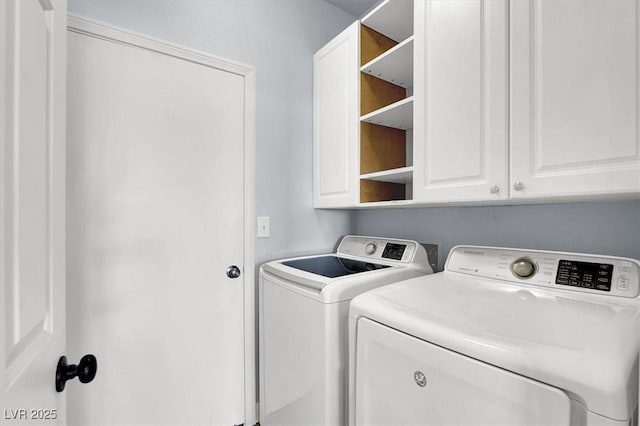 laundry area with cabinets and washer and dryer