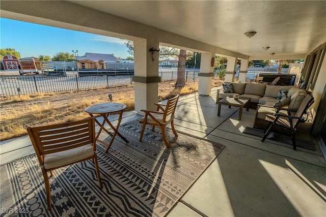 view of patio featuring an outdoor living space and a jacuzzi