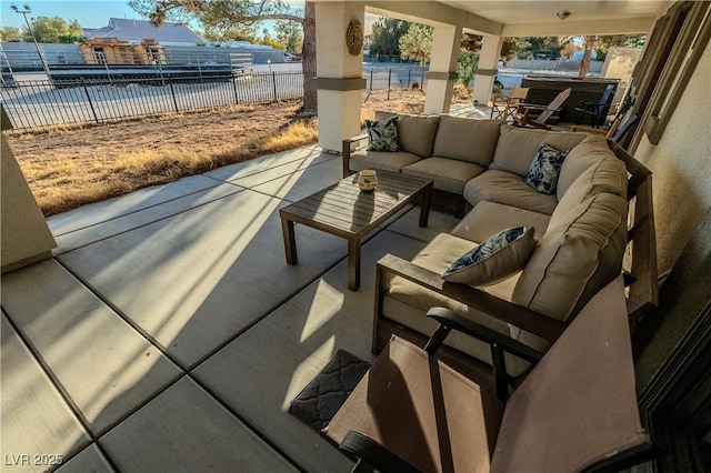 view of patio featuring a hot tub and an outdoor hangout area